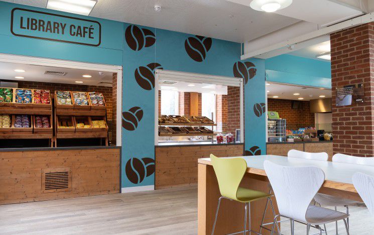 Interior of the library cafe showing a brightly lit counter