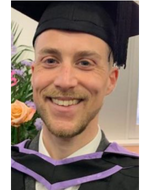 Headshot of James Bluring wearing a graduation cap